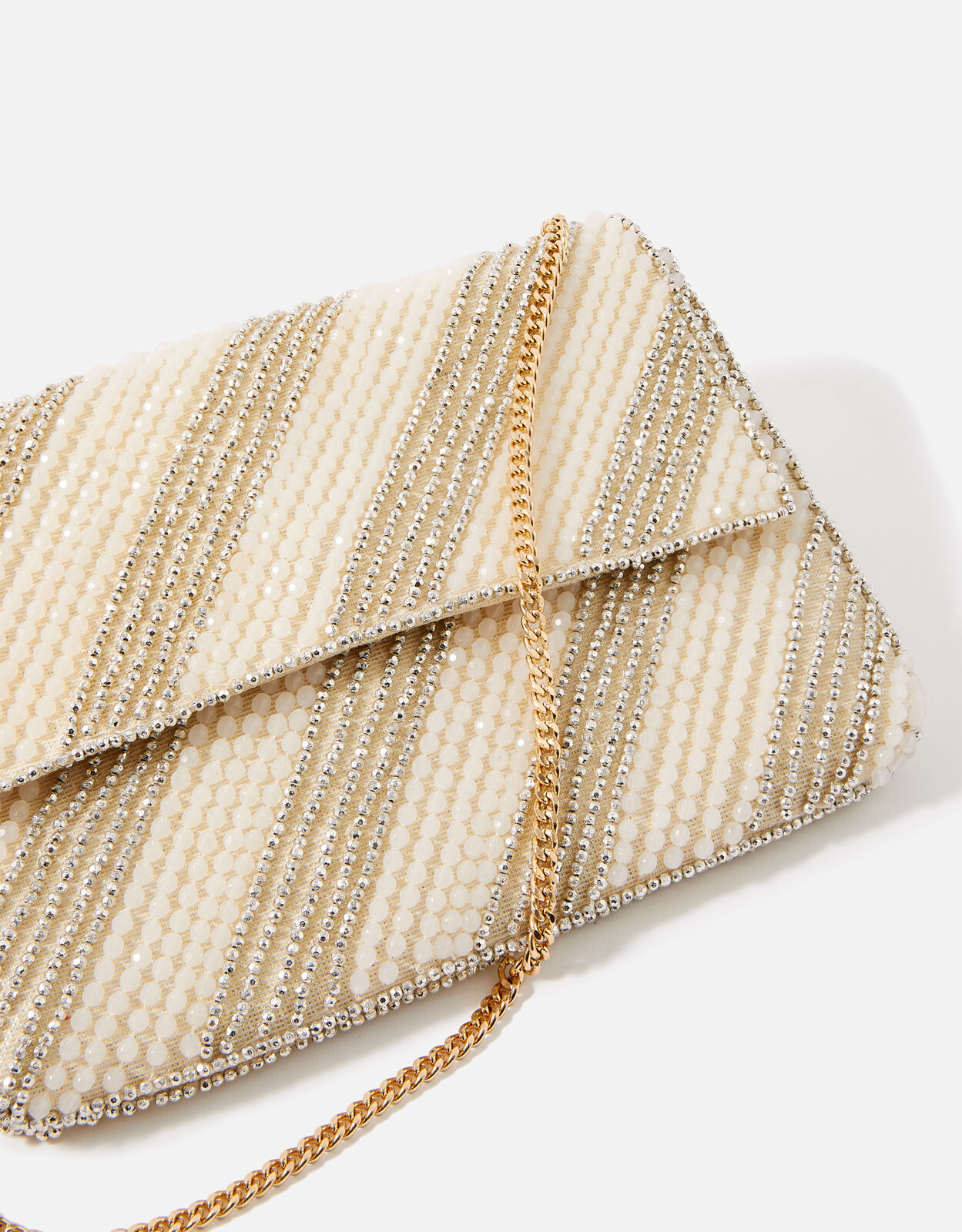 Cream and store gold clutch bag