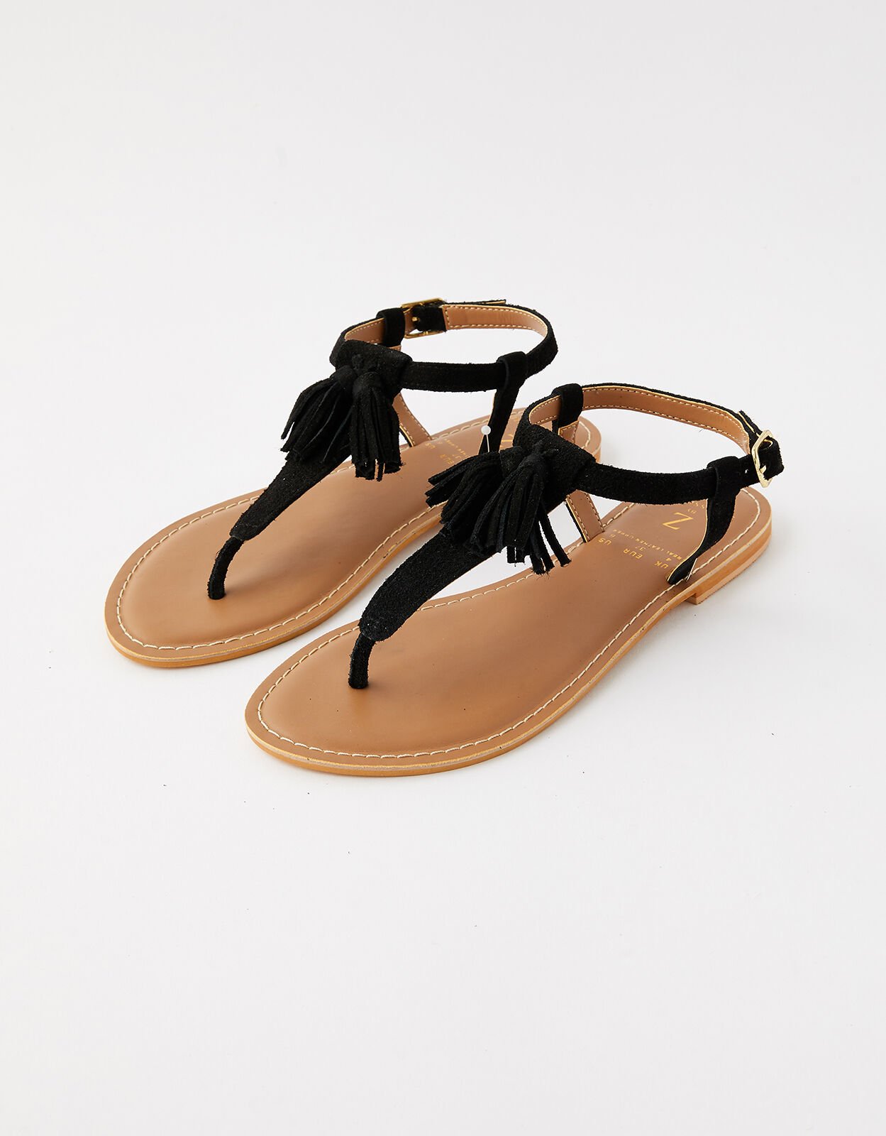 Black flat 2025 sandals with tassels