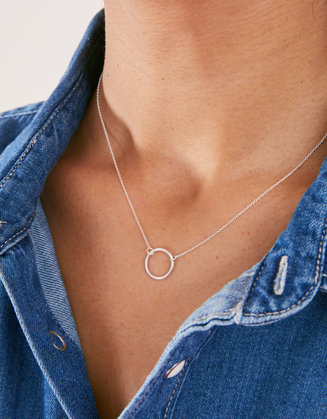Long silver necklace with circle pendant on sale