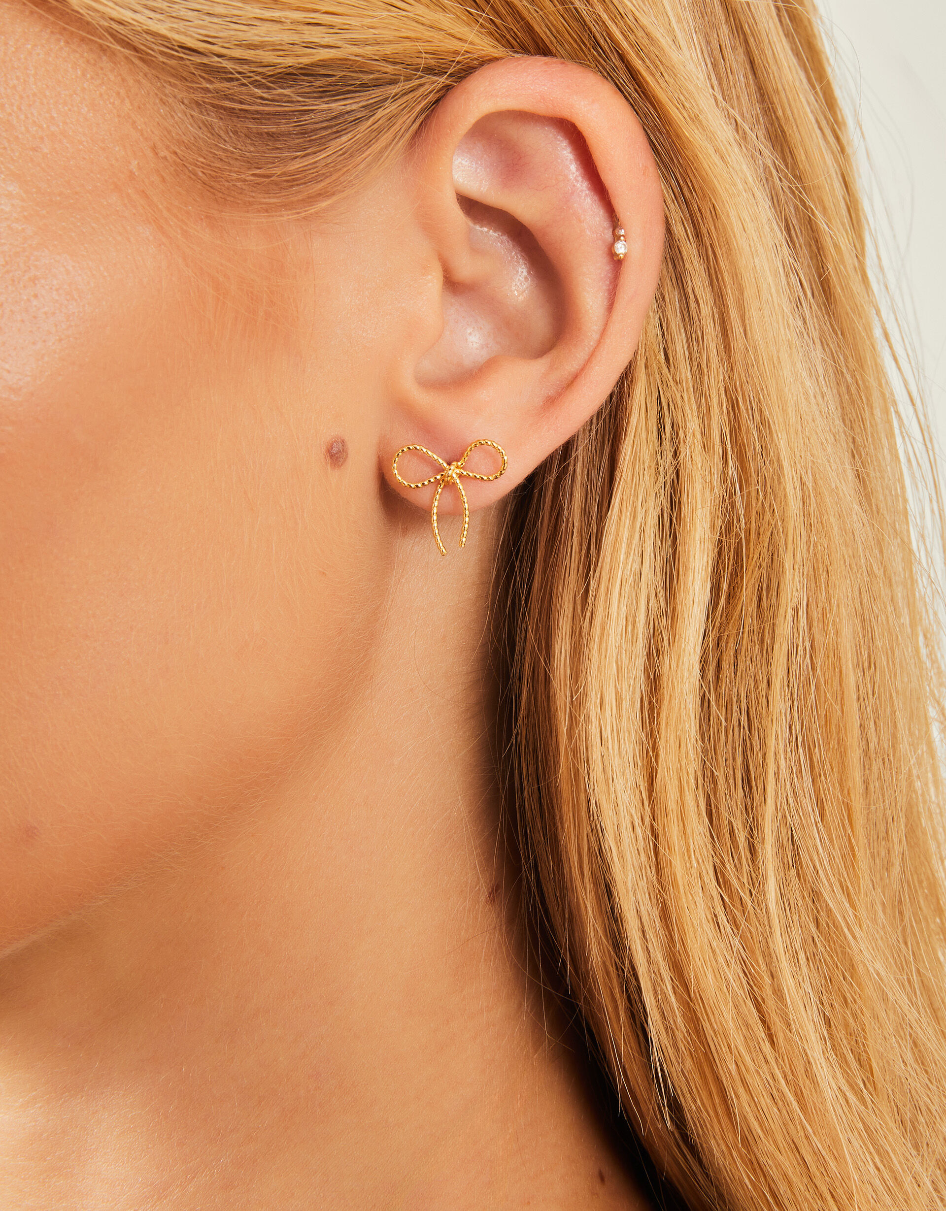 Rose gold bow earrings store