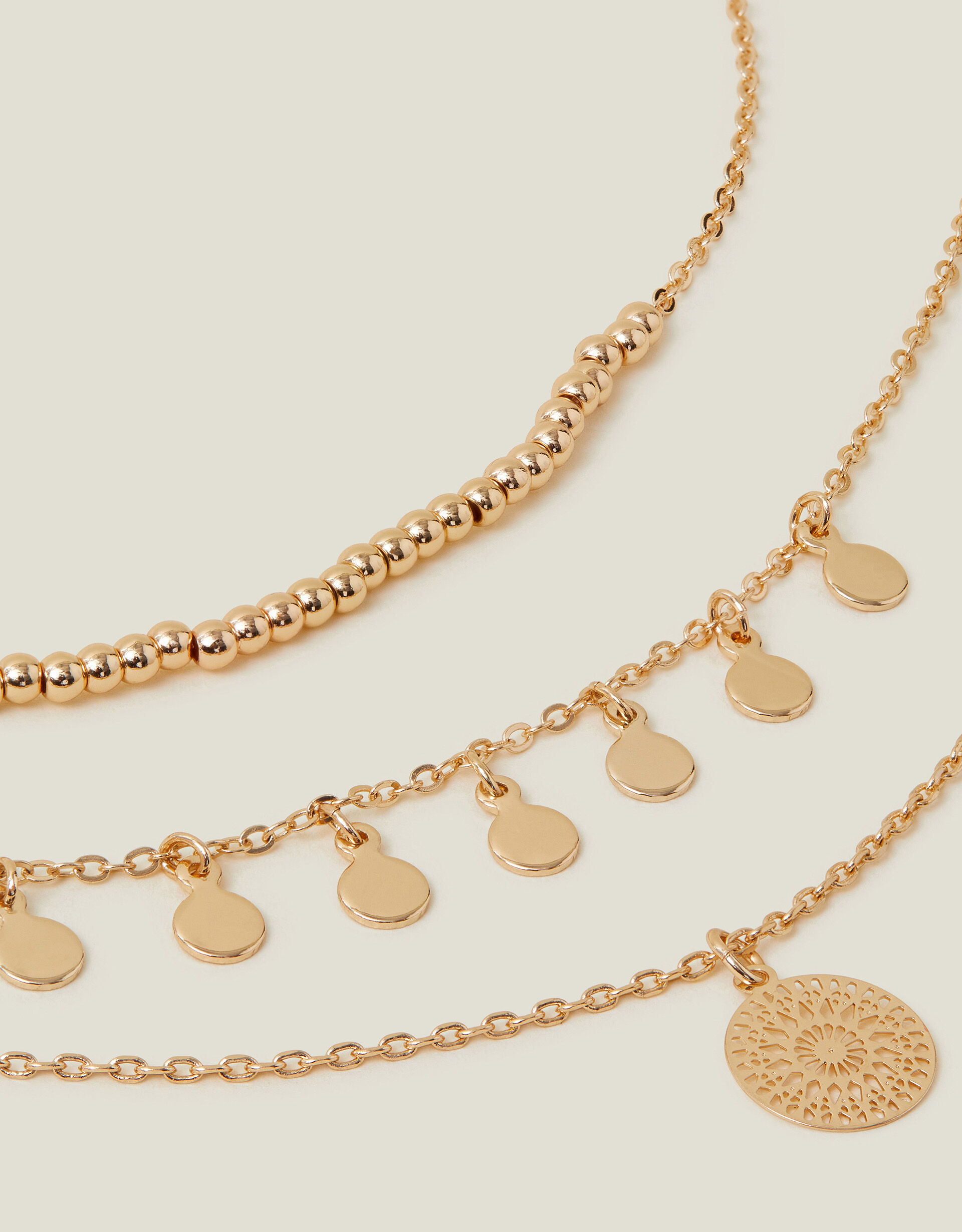 Accessorize gold necklace top