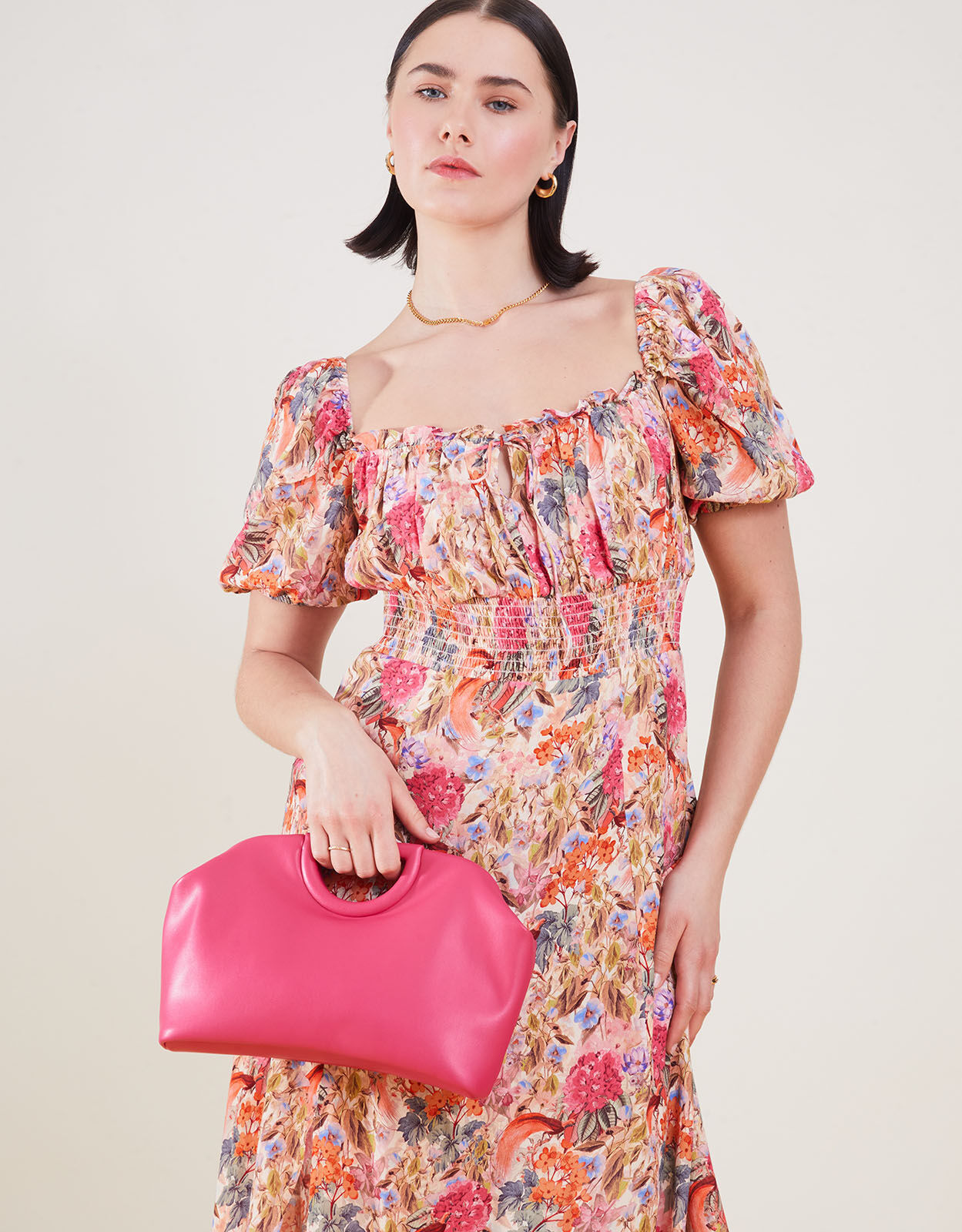 Accessorize pink clutch bag top