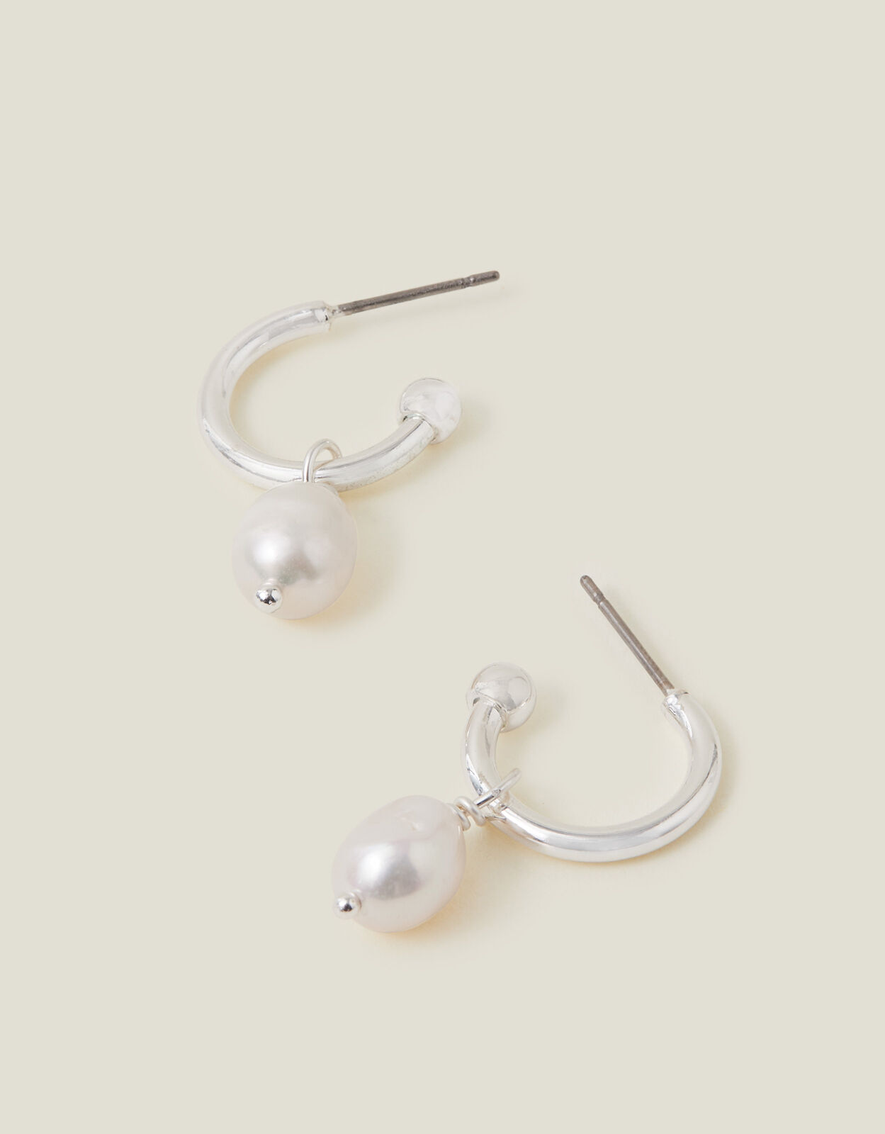 Silver hoop earrings accessorize top