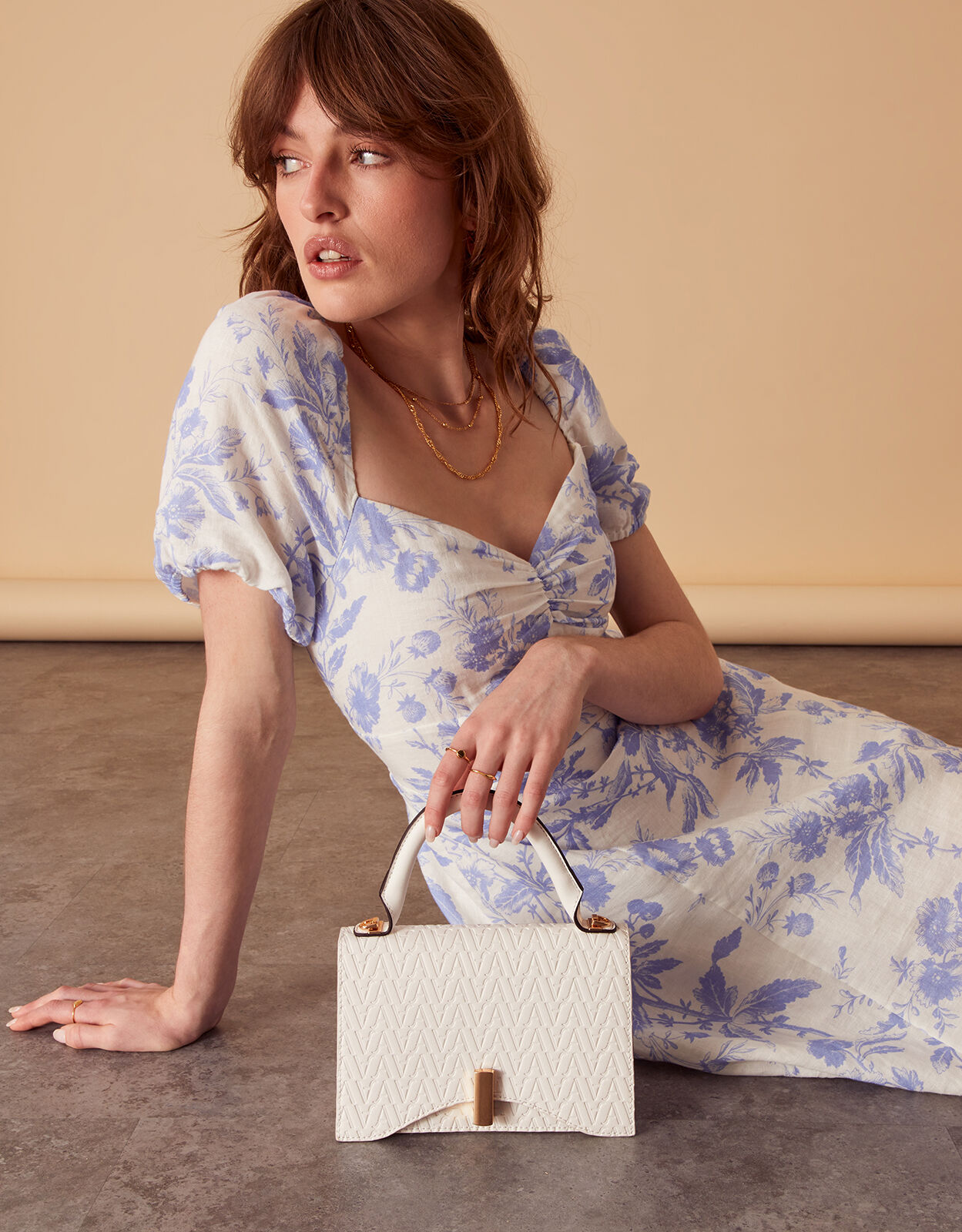 Small Logo Embossed Handheld Bag White
