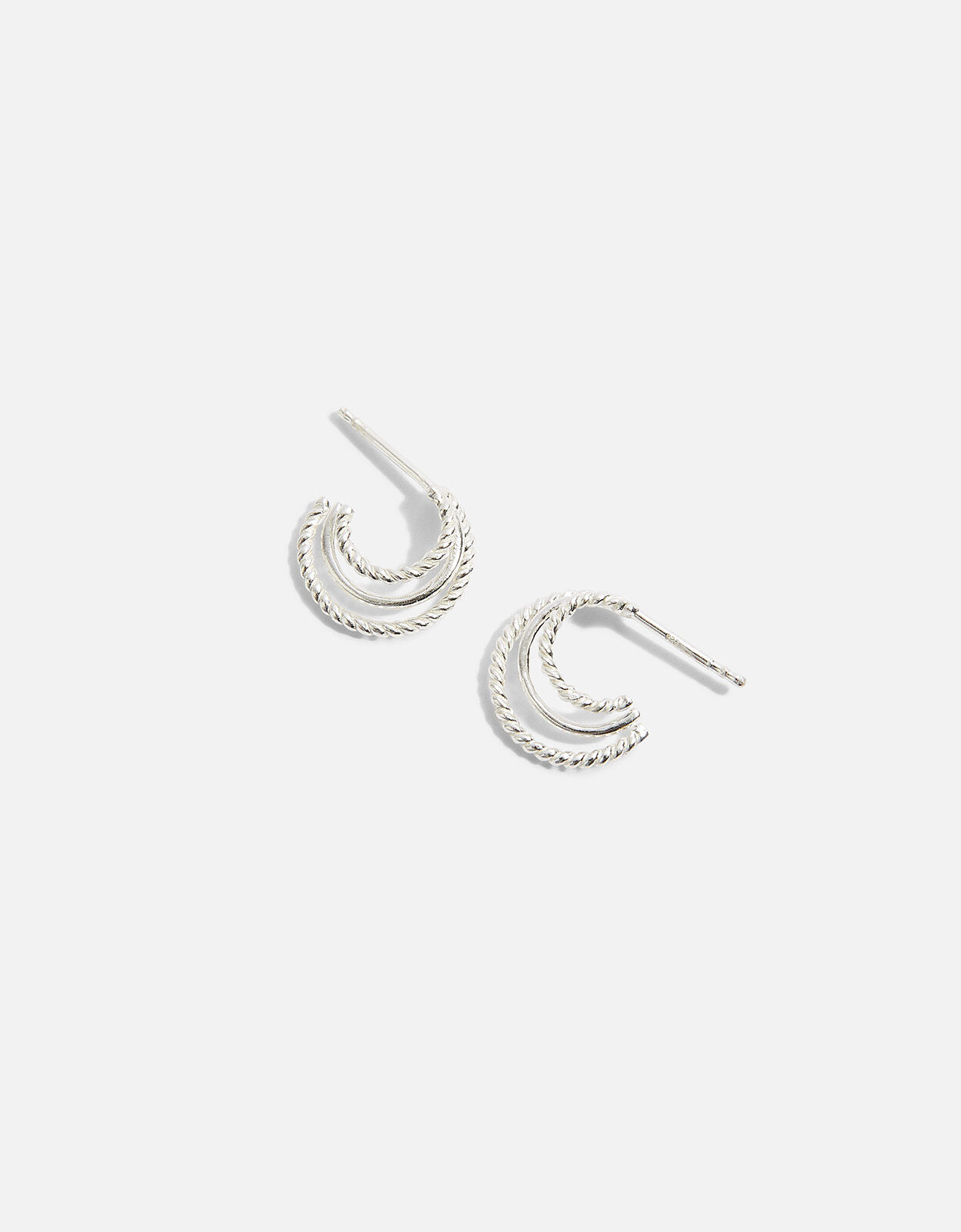 Silver hoop earrings accessorize top