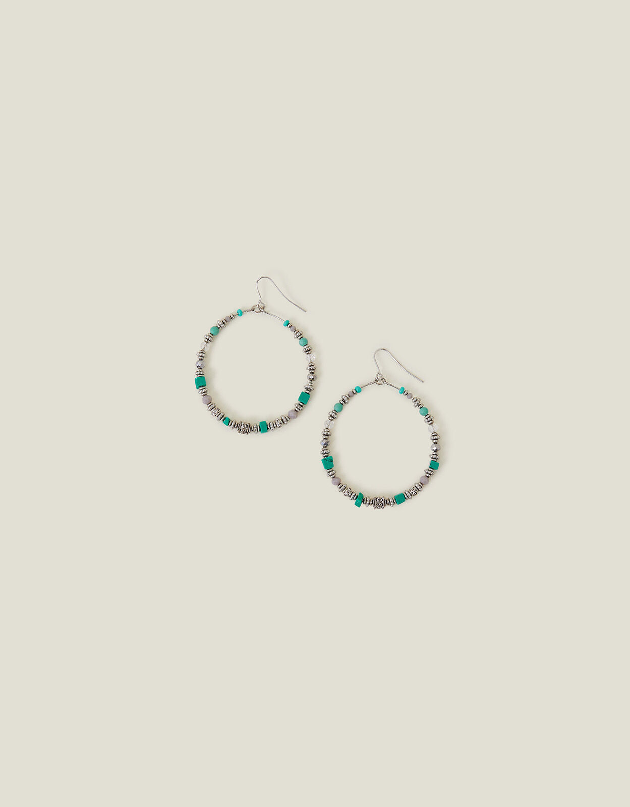 Blue earrings accessorize top