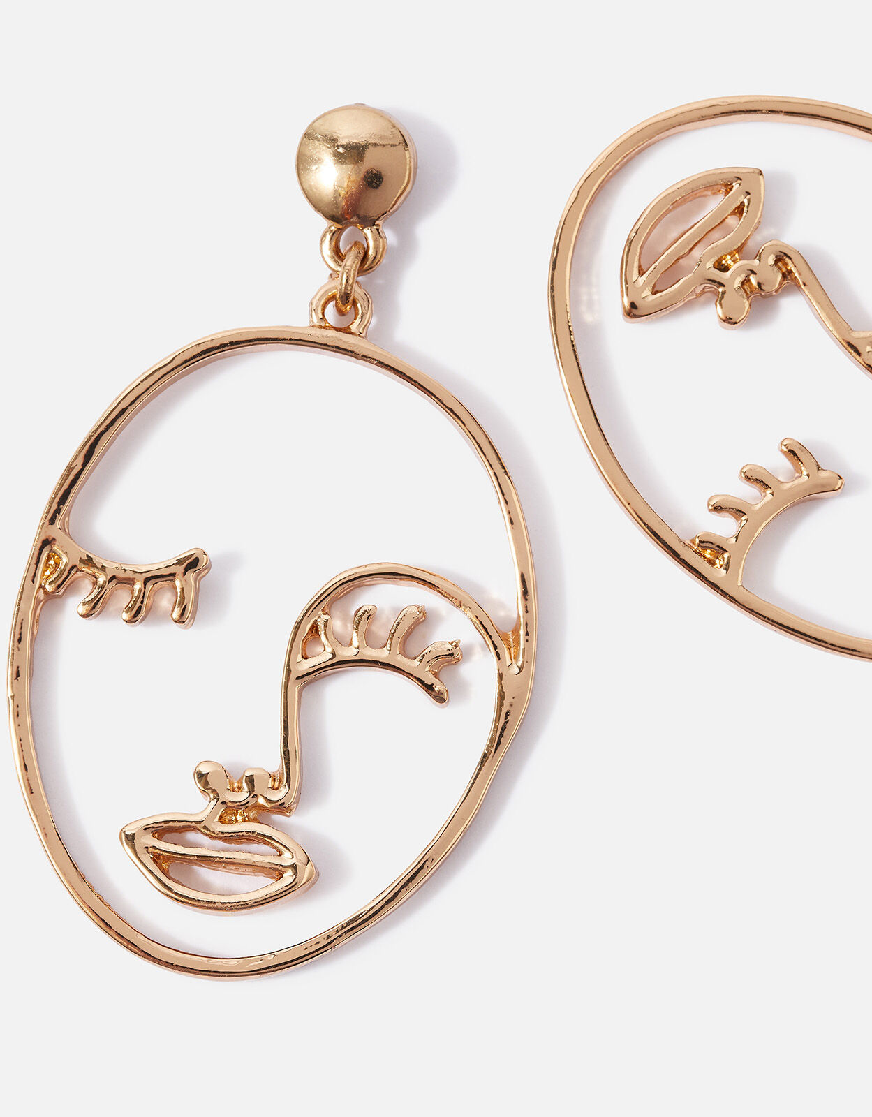 Gold face store earrings