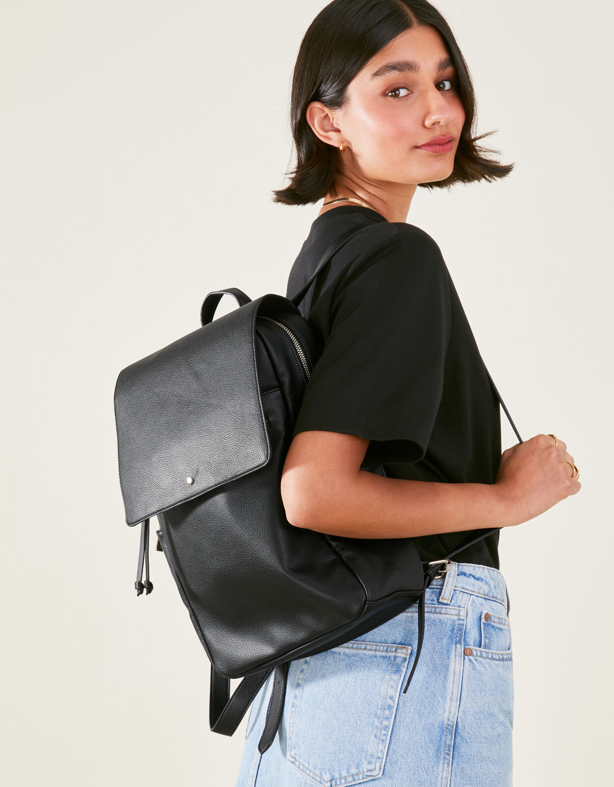 Fold over flap on sale backpack