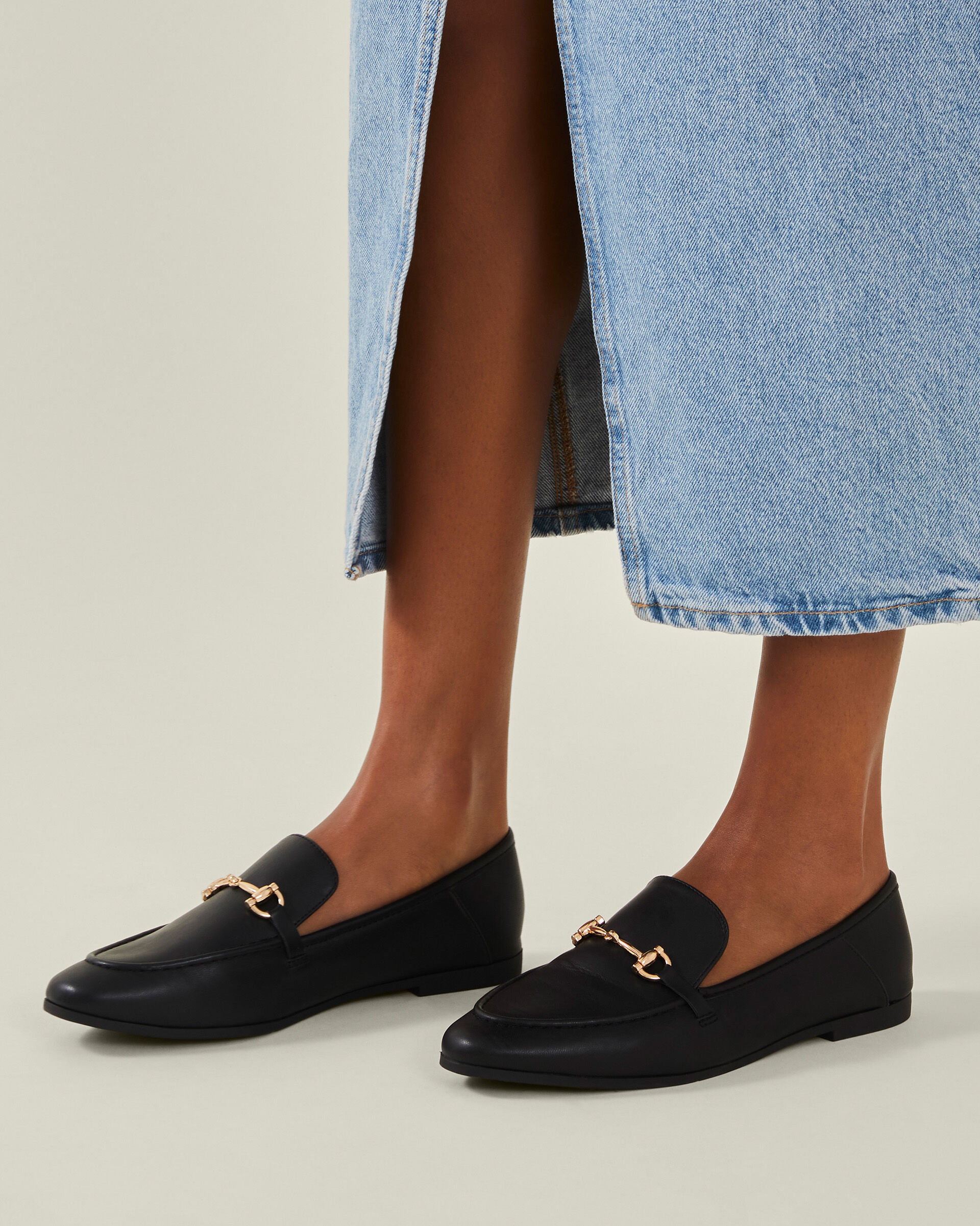 Black loafers with gold bar on sale