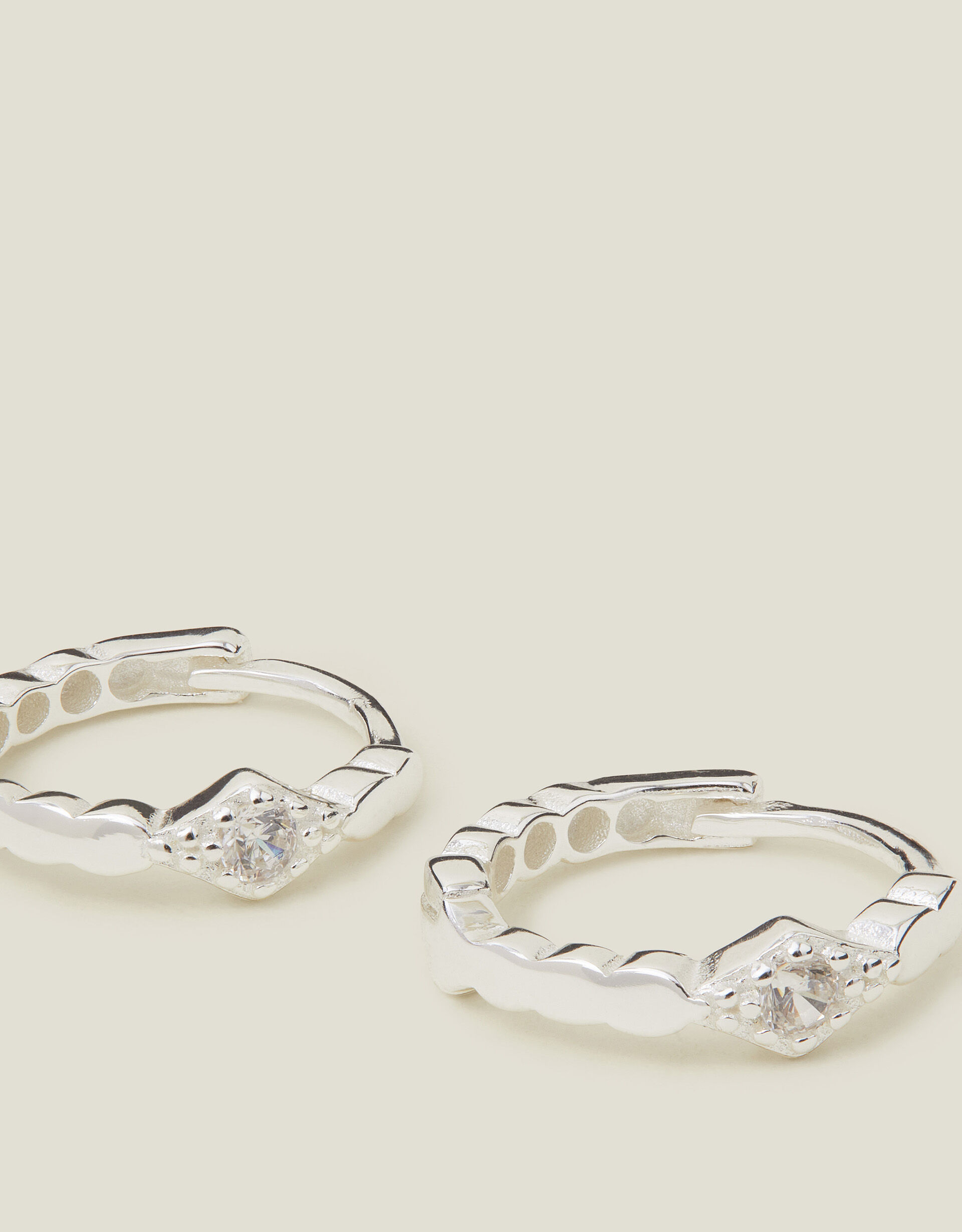 Silver diamond huggie earrings shop