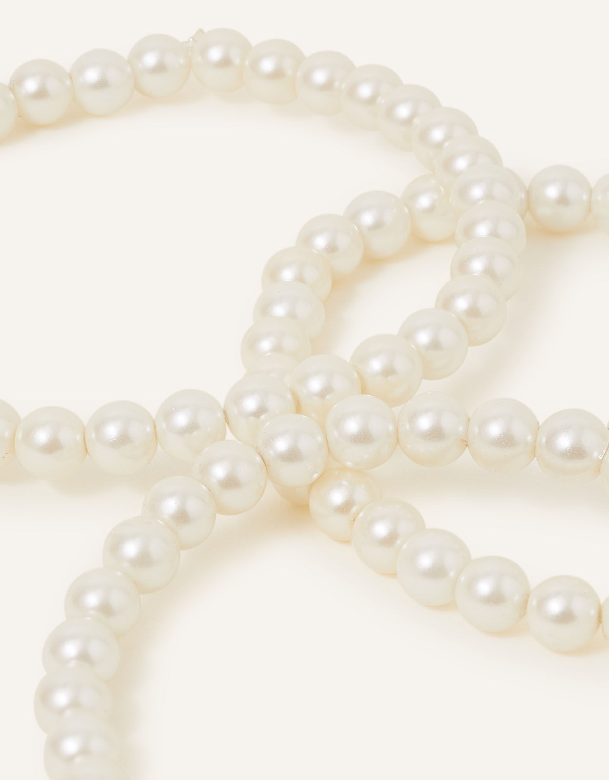 A group of modern costume jewellery, comprising chunky beaded and wooden  necklaces, faux pearl necklaces, crystal